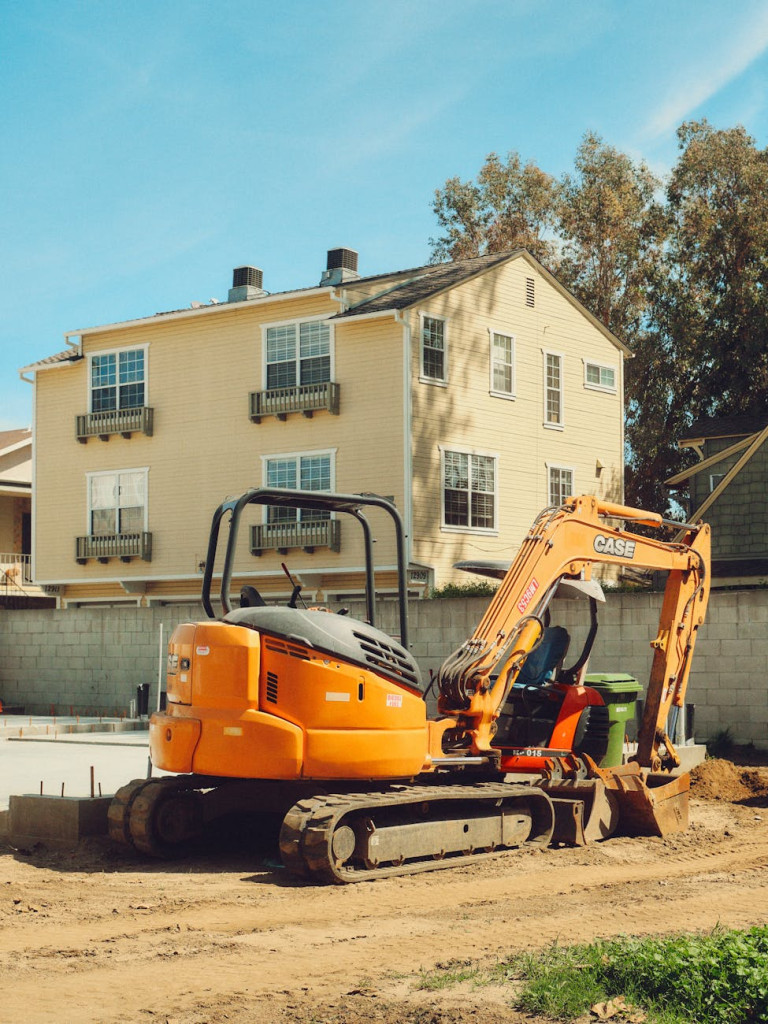 yellow excavator at los angeles construction site